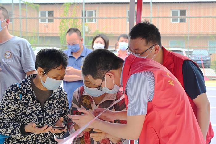1652082287127180.jpg 图5:志愿服务场景 - 副本.JPG